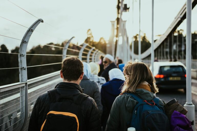 people walking on bridge