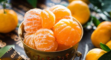 oranges in brass bowl